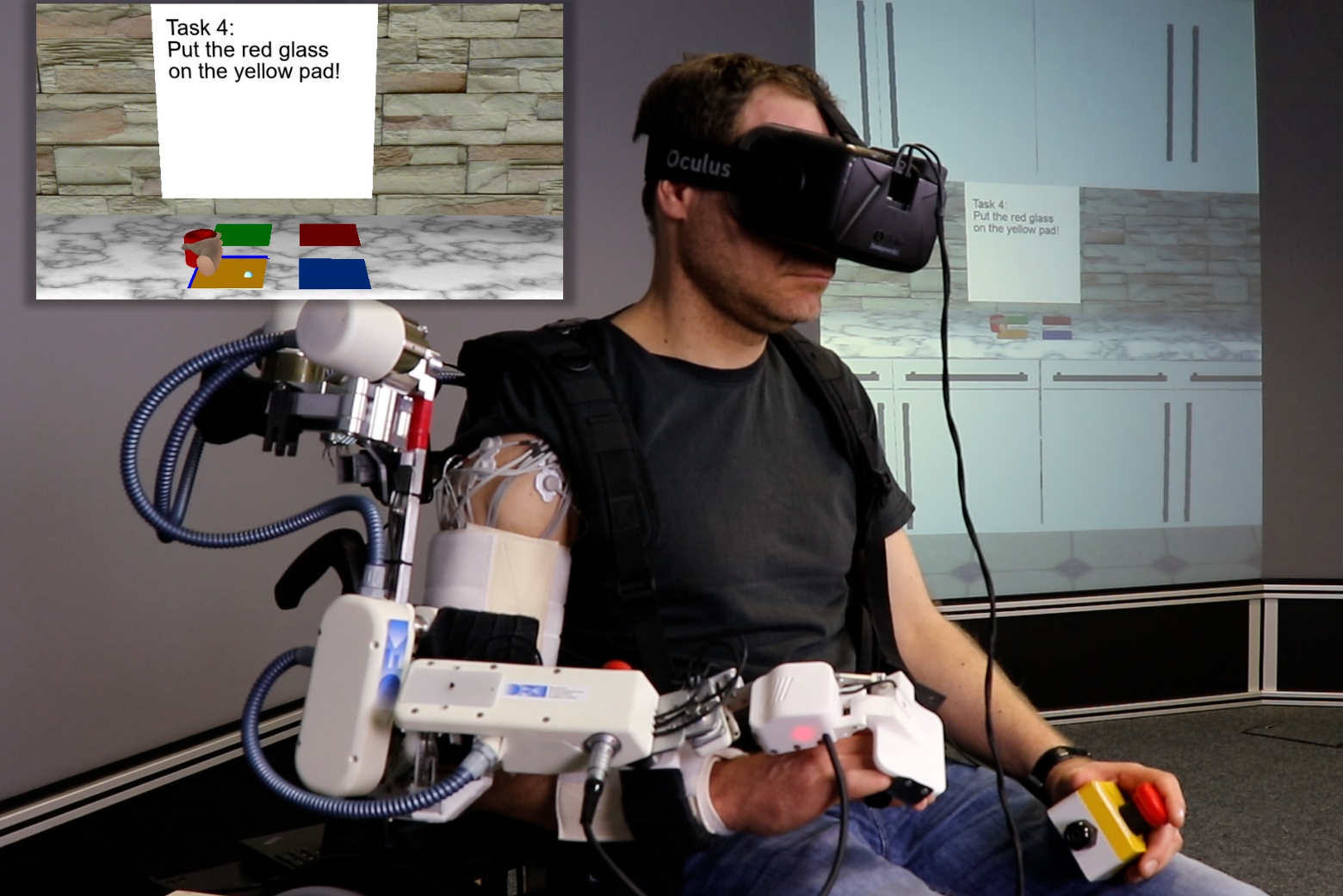 Ein Mann trägt eine VR-Brille und ist an einem Arm verkabelt