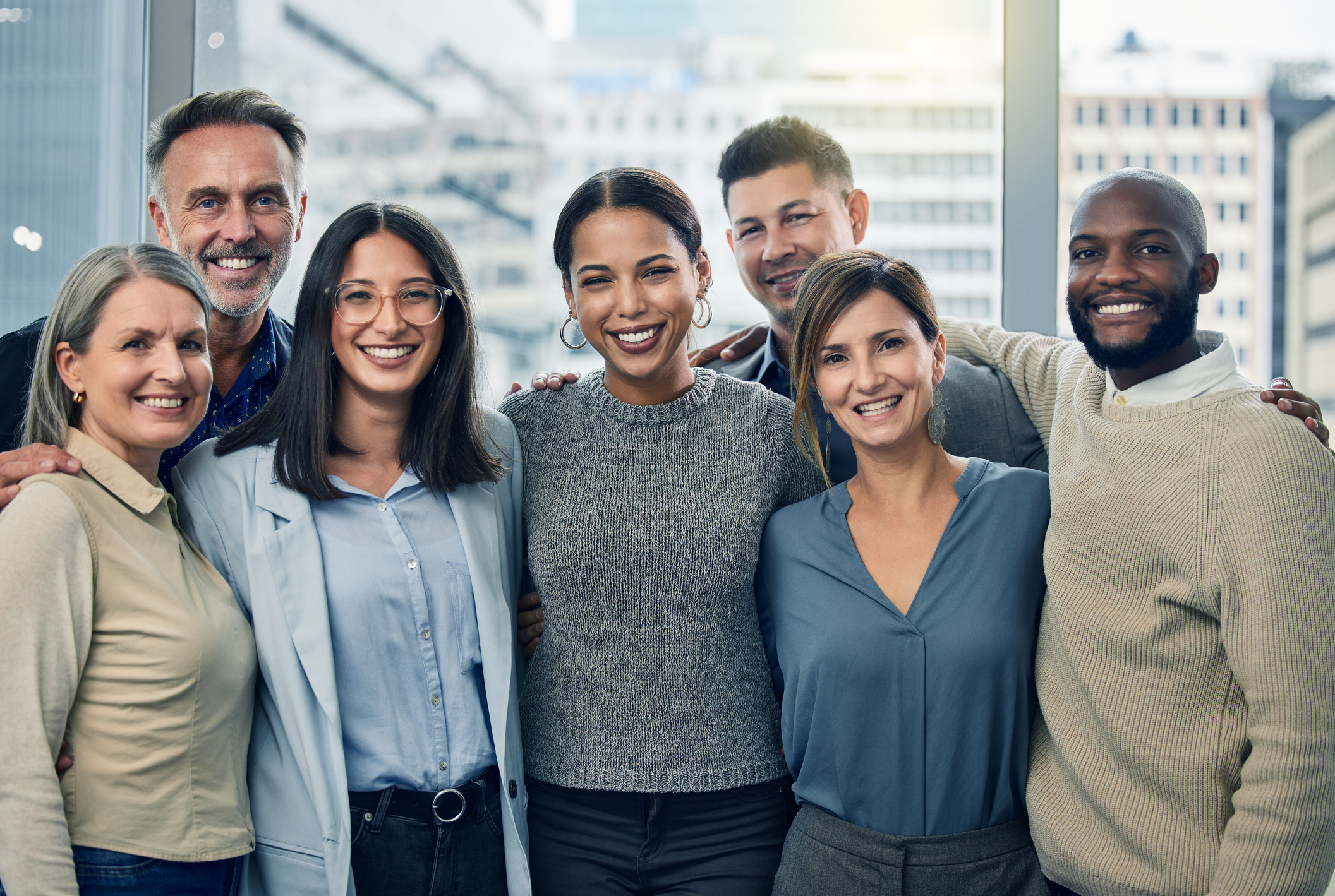 Shot of a team of colleagues together in their office